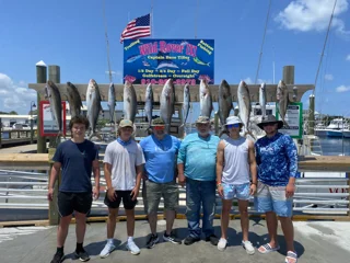 Group showing full rack of Amberjack and King Mackerel on live bait Big Fish trip